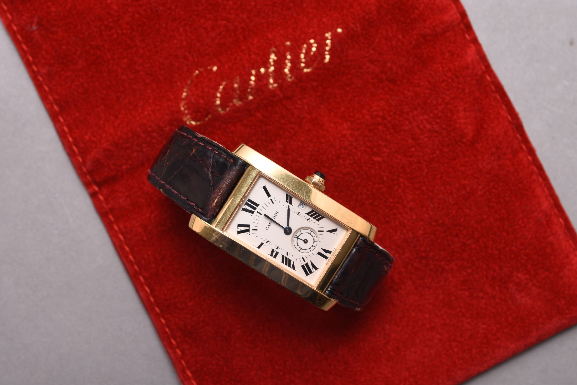 A Cartier Tank Américaine gentleman's 18ct gold wristwatch valued at up to £4,000. Halls Fine Art Christmas Auction